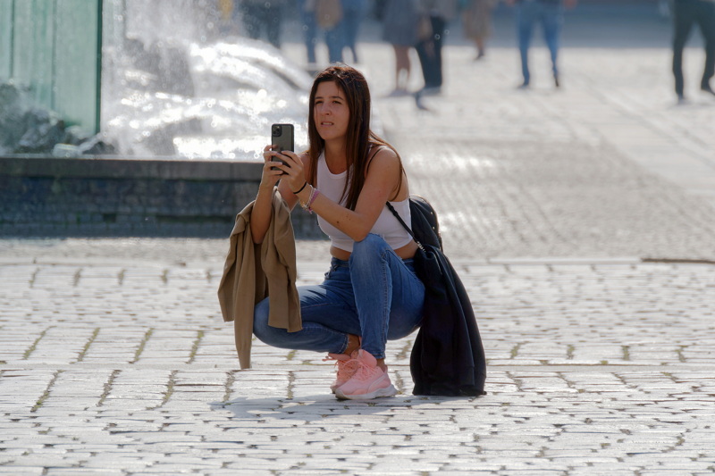 Girl squating and taking photos